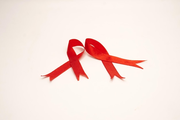 World Aids Day concept through two red silk ribbons