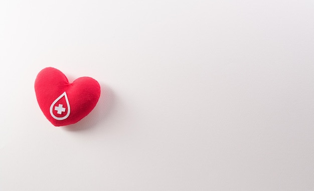 World blood donor day red cross and nurse day concept made from red heart on white background