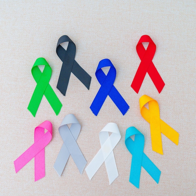 World cancer day February 4 Colorful ribbons for supporting people living and illness Healthcare fighting medical and National Cancer Survival day Autism awareness day concept