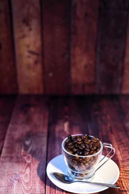 World coffee day concept white porcelain cup with coffee beans