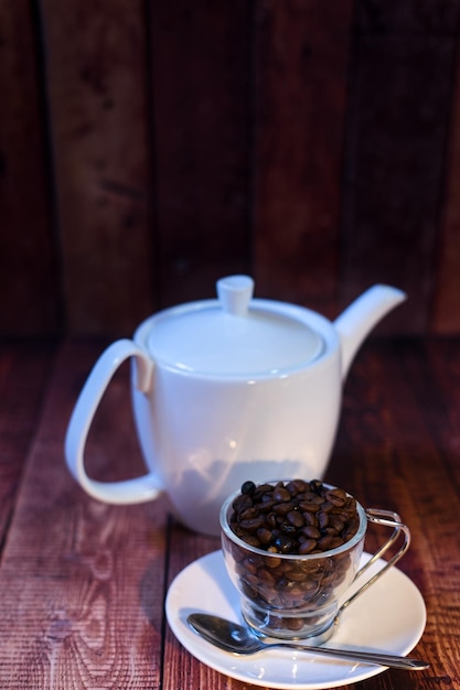 World coffee day concept white porcelain cup with coffee beans