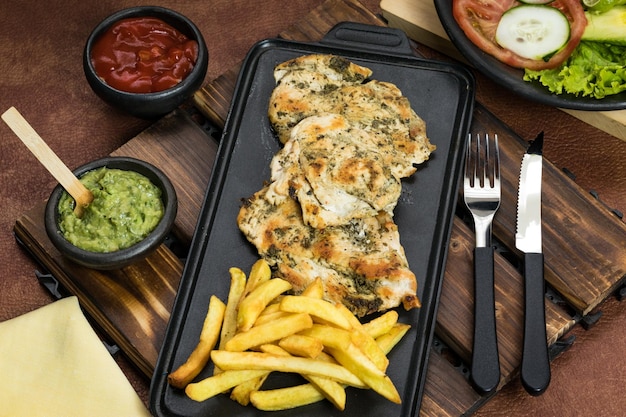 World Food Day grilled chicken breast with french fries in dining room healthy food