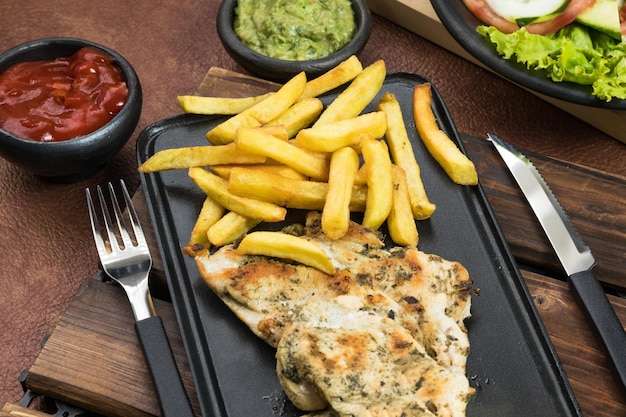 World Food Day grilled chicken breast with french fries in dining room healthy food