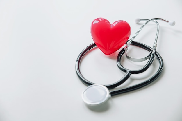 World health day.Red heart with stethoscope on white 