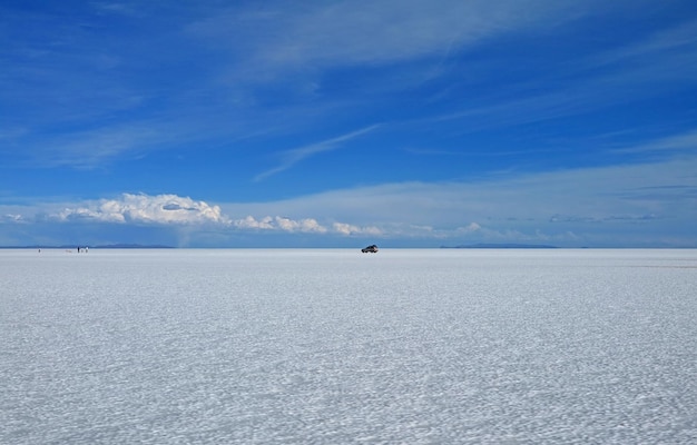 The World Largest Salt Flats with a Parking Van in Salar de Uyuni of Bolivia South America