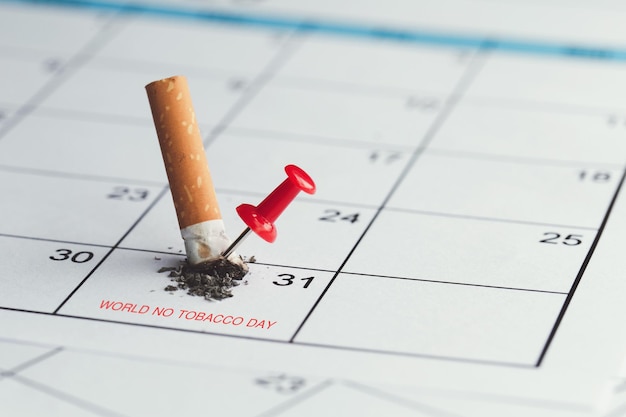 World No Tobacco Day The cigarette broke on the May 31 calendar and had a red pin on it the idea