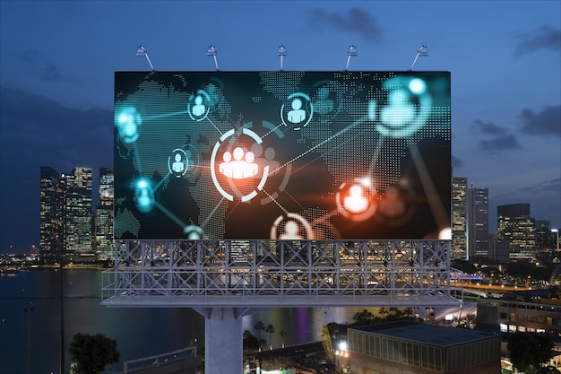 World planet Earth map hologram and social media icons on billboard over night panoramic city view of Singapore Southeast Asia Networking and establishing new connections between people Globe