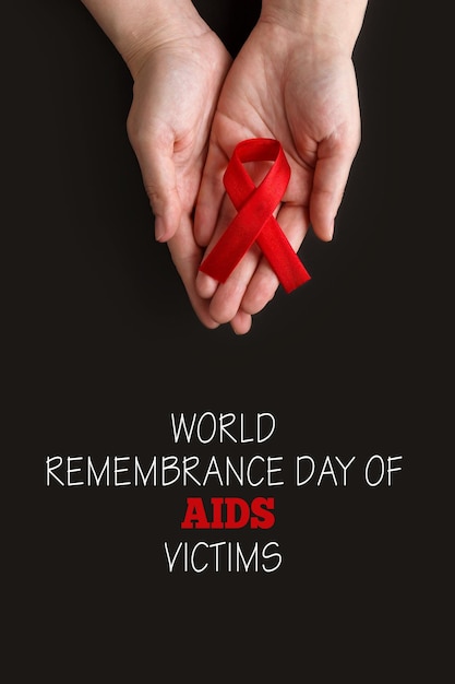 World Remembrance Day of AIDS Victims World AIDS and hiv day Adult holding red ribbon