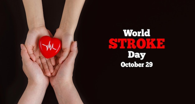 World Stroke day. October 29. The hands of the mother and child hold a heart with a heartbeat symbol.