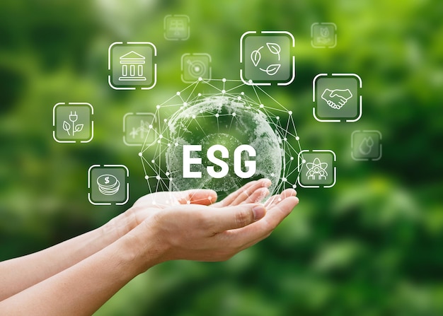 World sustainable environment concept Hand of human holding ESG icons for Environment Social and Governance on network connection