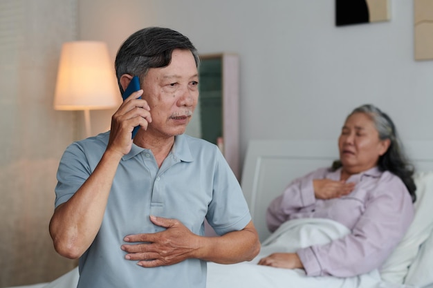 Worried Elderly Man Calling Ambulance