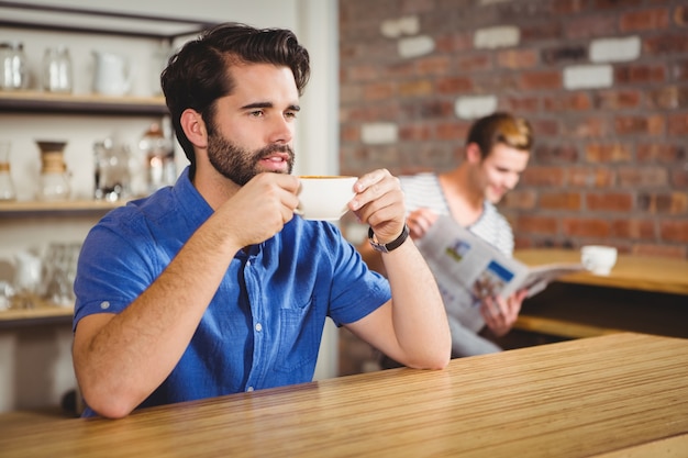 Worried man drinking a coffee