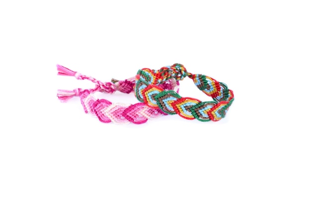 Woven DIY friendship bracelets handmade of embroidery bright thread with knots on white