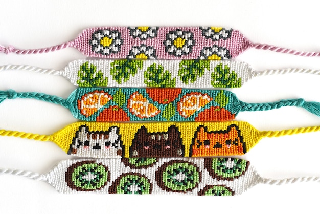 Woven DIY friendship bracelets with alpha patterns