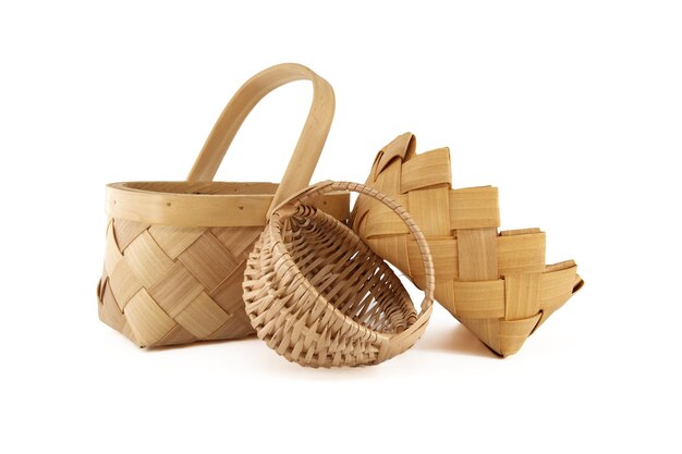 Woven wicker baskets for harvesting and storage isolated on white