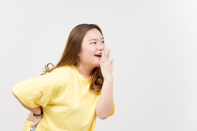 WOW Face Expression of Beautiful Asian Woman wearing yellow TShirt Isolated On White Background