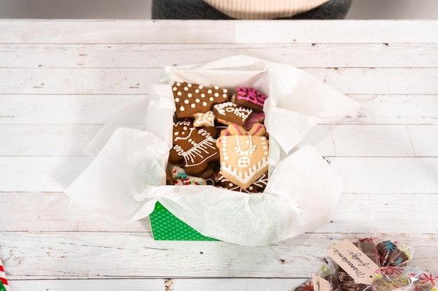 Wrapping homemade gingerbread and sugar Christmas cookies for presents.