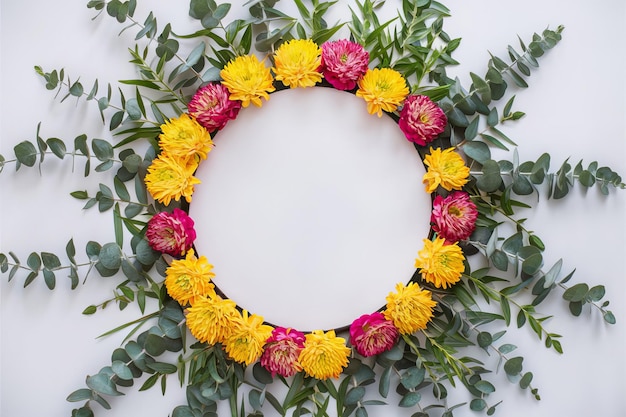 a wreath of flowers with a round frame on the top