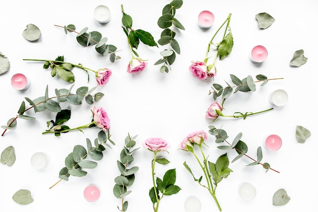 Wreath frame with roses eucalyptus branches leaves isolated on white background flat lay overhead view