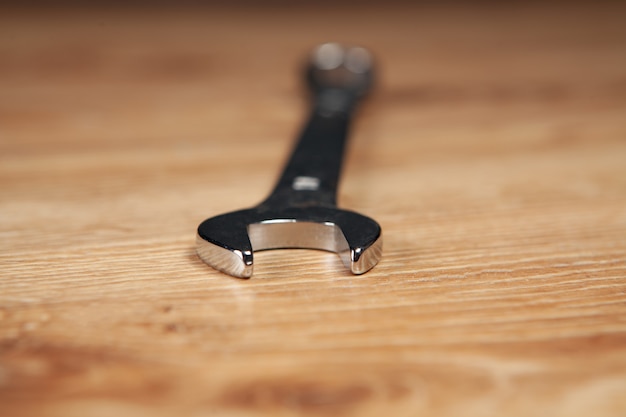 Wrench close-up on a wooden table