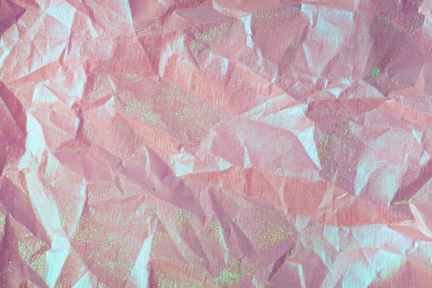 wrinkled purple pink holographic crumpled paper abstract background