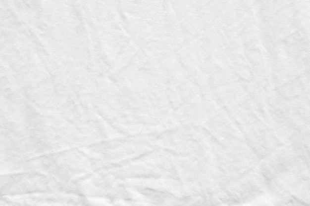 Wrinkled white cotton fabric textured background