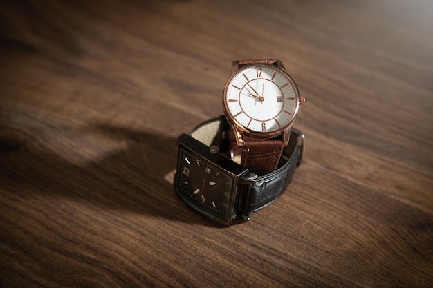 Wristwatch on the wooden background