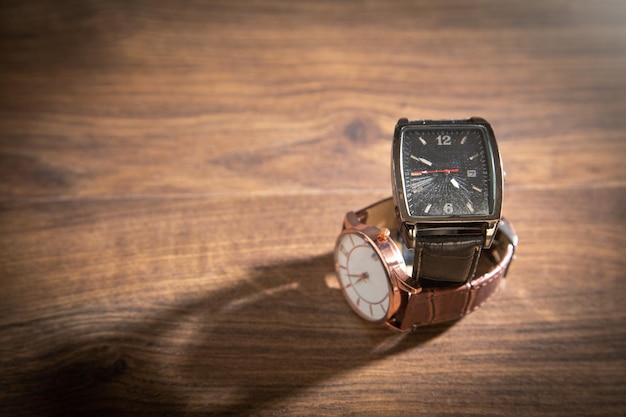 Wristwatch on the wooden background