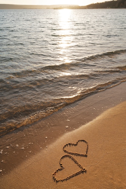 Photo writing words in the sand