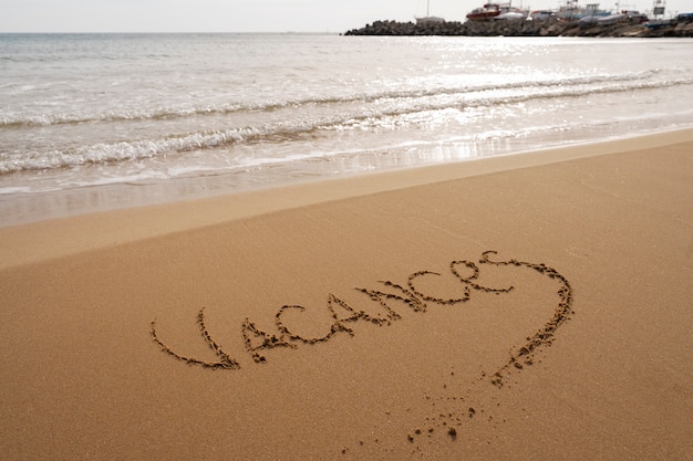 Photo writing words in the sand