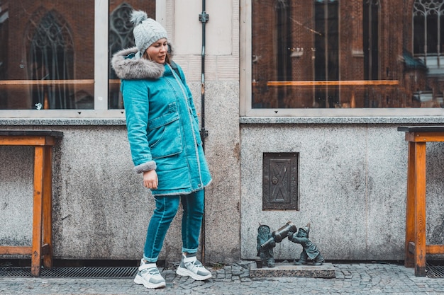 Wroclaw Poland January 30 2020 A girl near the famous Wroclaw dwarves