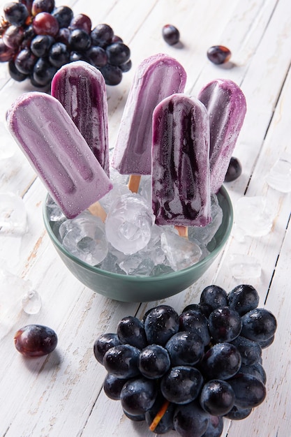 XAGrape popsicles in bowl with ice cubes