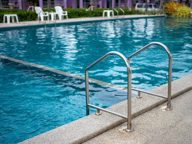 XAStainless steel stairs to the pool handrails up and down the pool