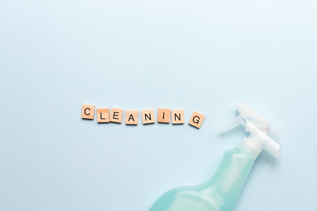 XAWord cleaning from wooden letters Spray for cleaning Cleaning agent Purity Flatly cleaning on a blue background