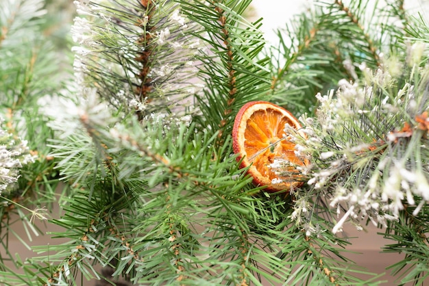 Xmas background with decorated Christmas tree close up Winter or New Year cozy holidays concept Selective focus