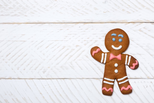 Xmas gingerbread man on wooden boards Christmas festive background