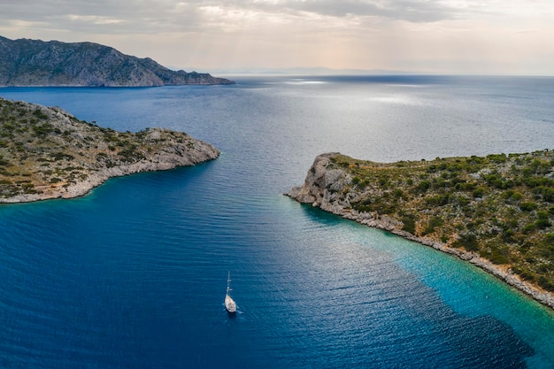 Yacht sailing near the rocky coast in Turkey Luxury vacation at sea