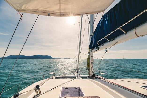 Yacht sailing on tropical sea in sunny day Private yachting Leisure acitivities Recreational pursuit Travel and summer concept