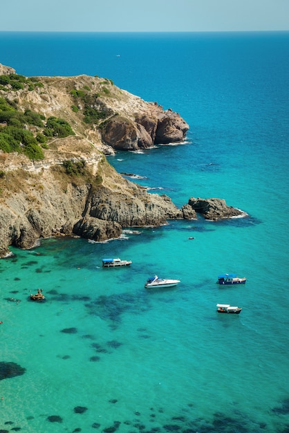 Yachts in the bay of the blue tropical sea