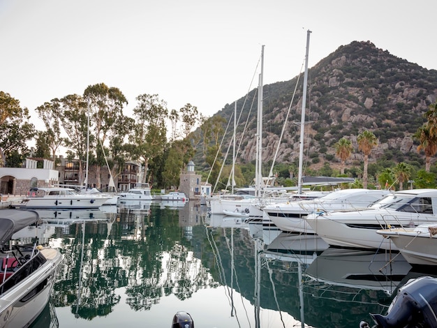 Yachts and motor boat in marina port