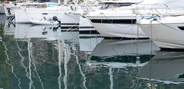 Yachts and motor boat in marina port