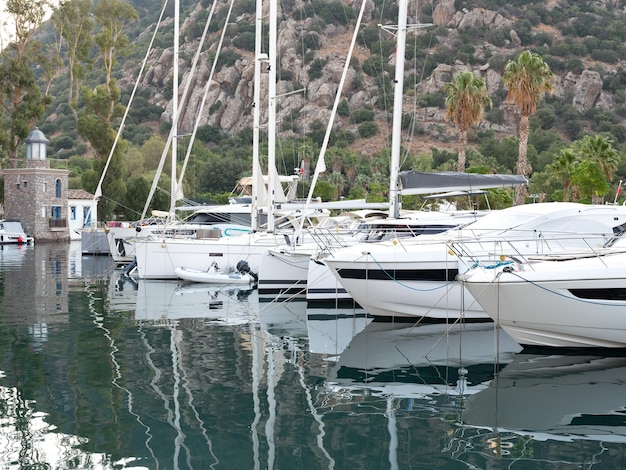 Yachts and motor boat in marina port