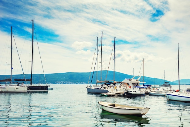 Yachts in the sea port of Tivat, Montenegro. Kotor bay, Adriatic sea. Famous travel destination.