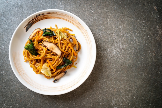 yakisoba noodles stir-fried with vegetable in asian style - vegan and vegetarian food