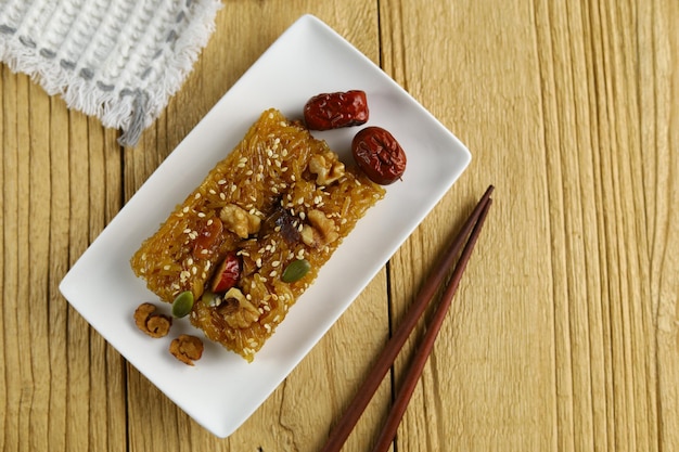 Yaksik or yakbap is a tteok made from glutinous rice with chestnut jujube and pine nuts