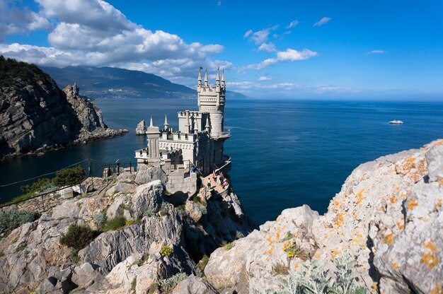 Yalta. swallow's nest. top view of the ancient castle on a rock. the symbol of the Republic of Crimea on the background of blue sea.