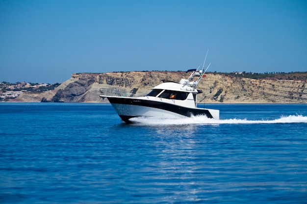 Yatch speeding on the water