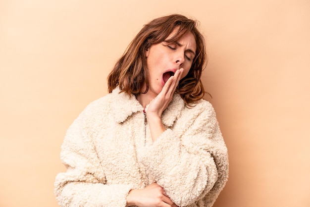 Yawning showing a tired gesture covering mouth with hand