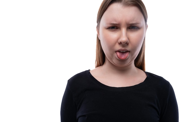 year old caucasian girl with brown hair grimaces