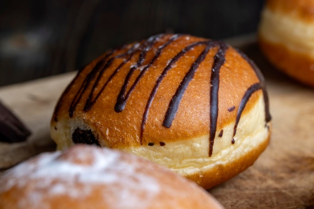 Yeast Sweet Donuts with Chocolate Filling sweet donuts with chocolate filling on the table